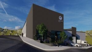 Render exterior de una nave industrial con diseño contemporáneo, mostrando su área de oficinas y el acceso a la bodega.
