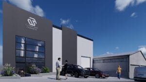 Render exterior de una nave industrial con diseño contemporáneo, mostrando su área de oficinas y el acceso a la bodega.